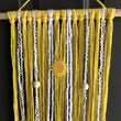 Load image into Gallery viewer, Yellow macramé wall hanging with wood beads