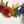 Load image into Gallery viewer, rainbow wreath flowers up close
