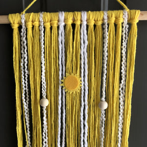 Yellow macramé wall hanging with wood beads